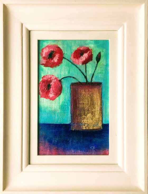 Poppies in gold vase