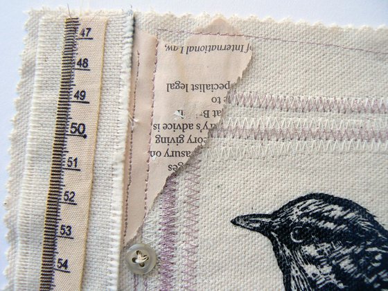 Little Jenny (Wren) textile and lino print stitched collage with buttons fabric and found papers