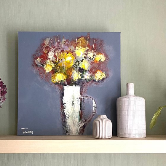 Flowers in a white jug.