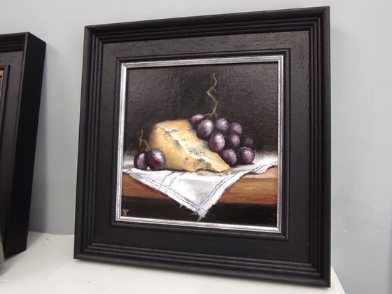 Cheese and grapes still life