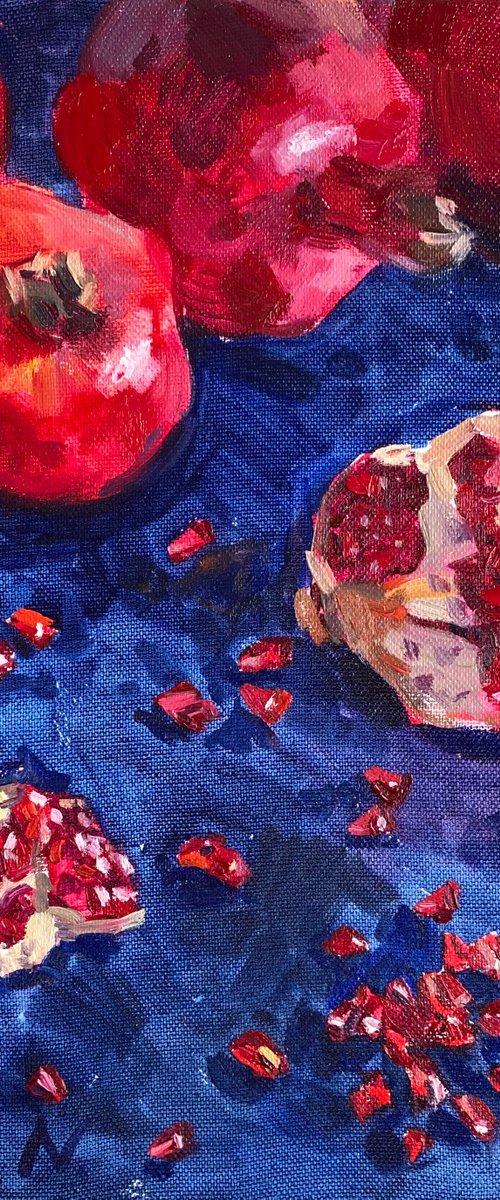Pomegranates on blue by Nataliia Nosyk