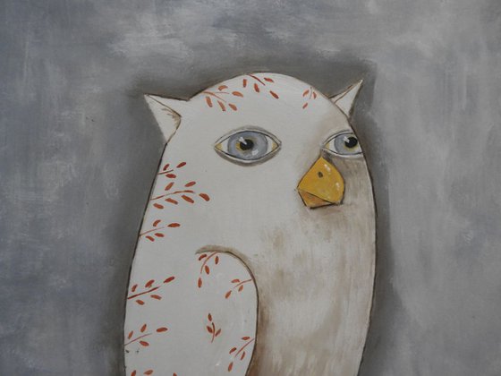 The freaky white owl on the branch