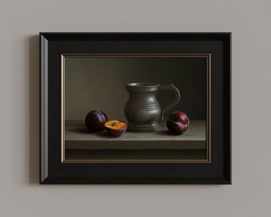 Antique pewter tankard with plums