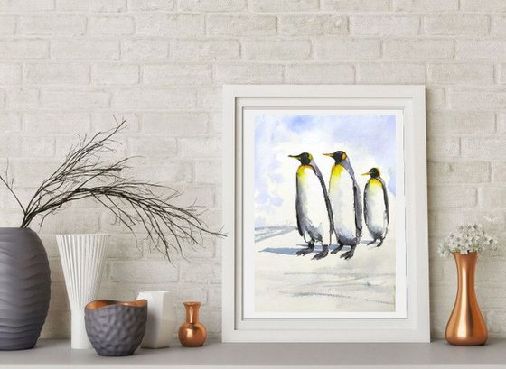 Three penguins on a morning walk