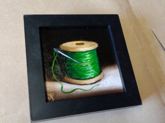 Little  green cotton reel  still life