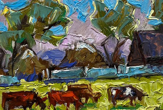 Cows on a green field