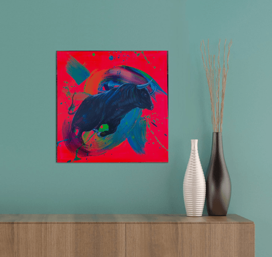 Running bull on a pink background