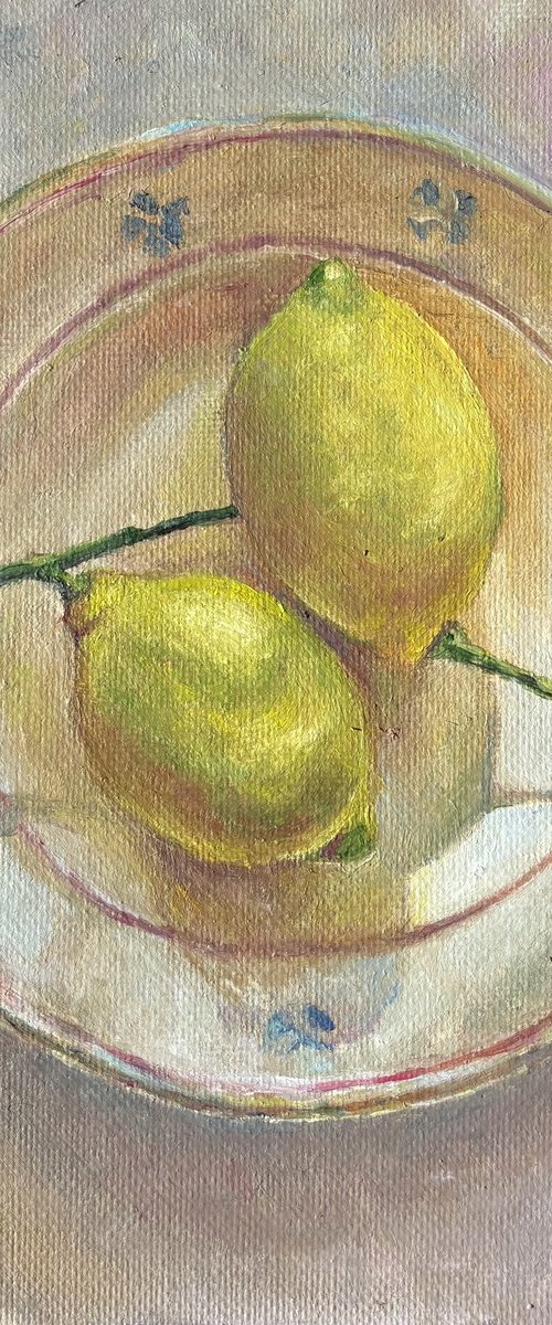 Lemons on the plate by Anastasiya Kostyuk