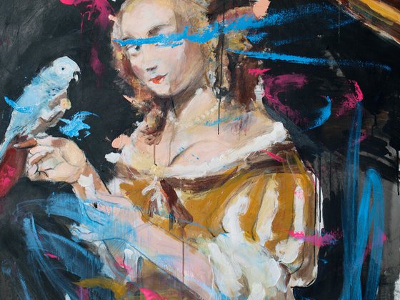 Young woman feeding a parrot