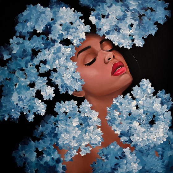 Girl in blue hydrangea blossom