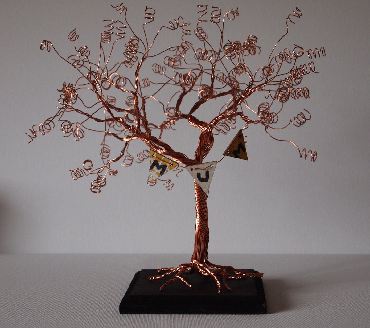 Copper wire tree sculpture with bunting by Steph Morgan