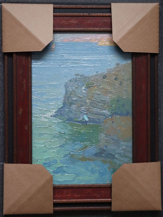 A lonely white sail gleams