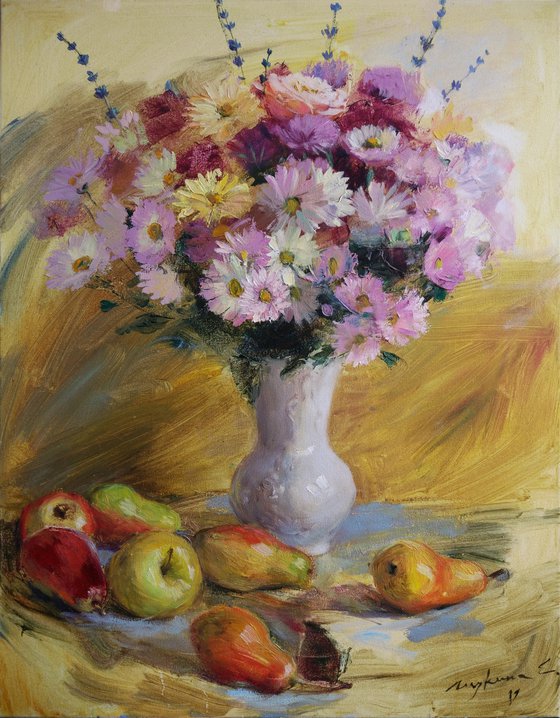 Autumn gifts. Flowers and fruits