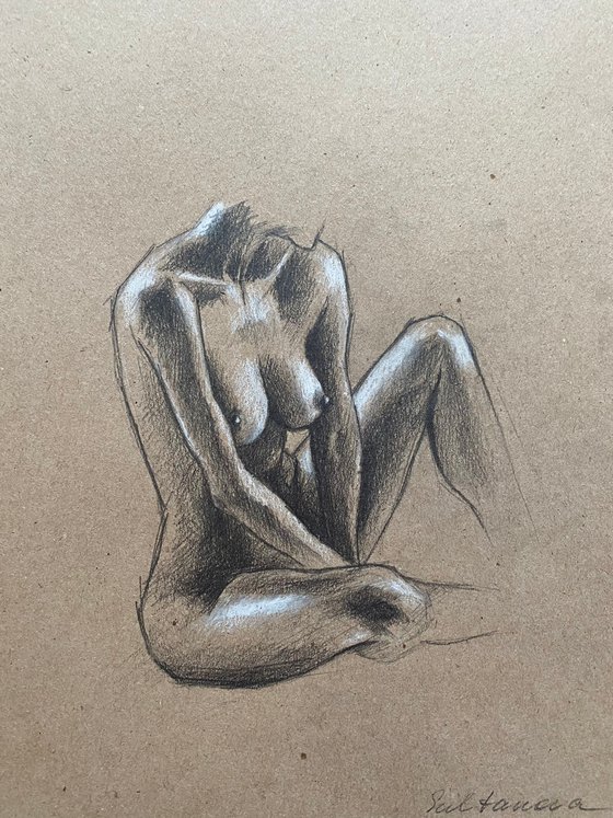 Nude sitting woman