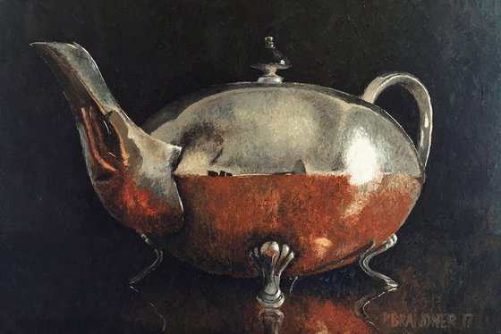 Teapot on polished table