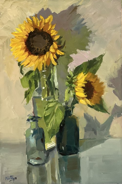 Sunflowers with little blue glasses by Nithya Swaminathan