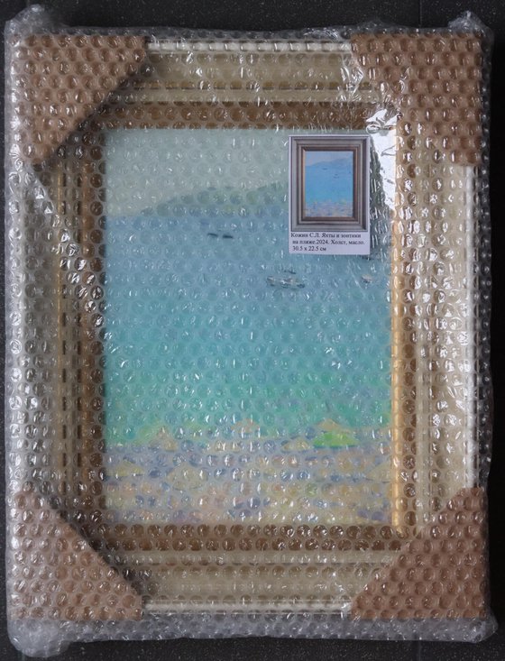 Yachts and umbrellas on the beach