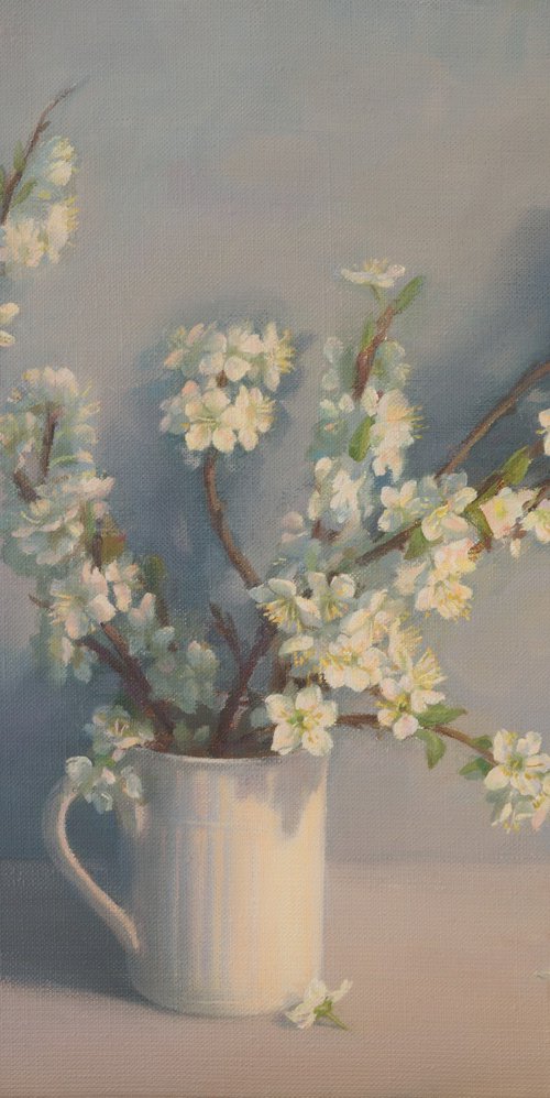 Flowering branches in a white mug by Irina Trushkova