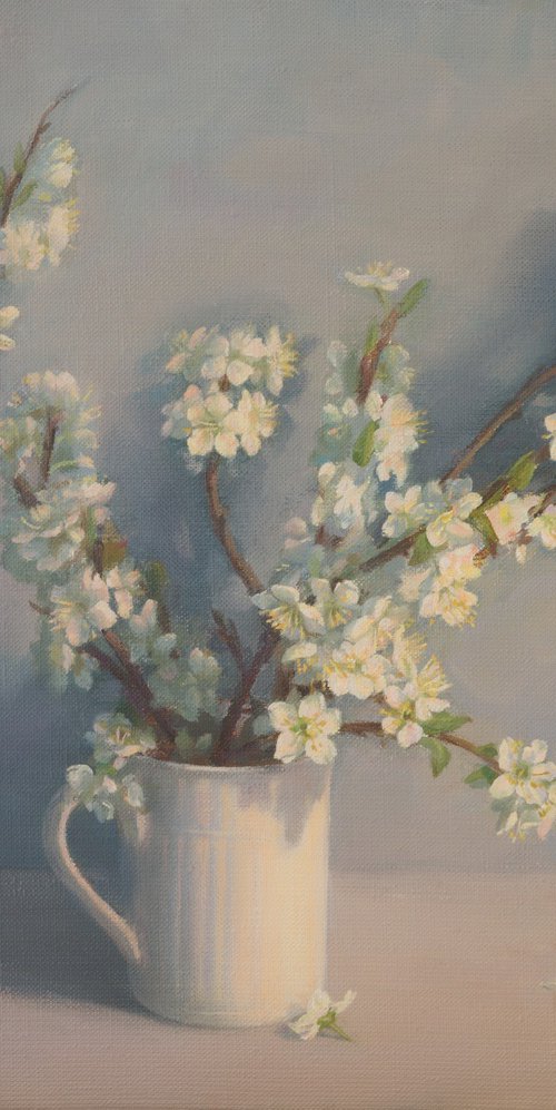 Flowering branches in a mug by Irina Trushkova