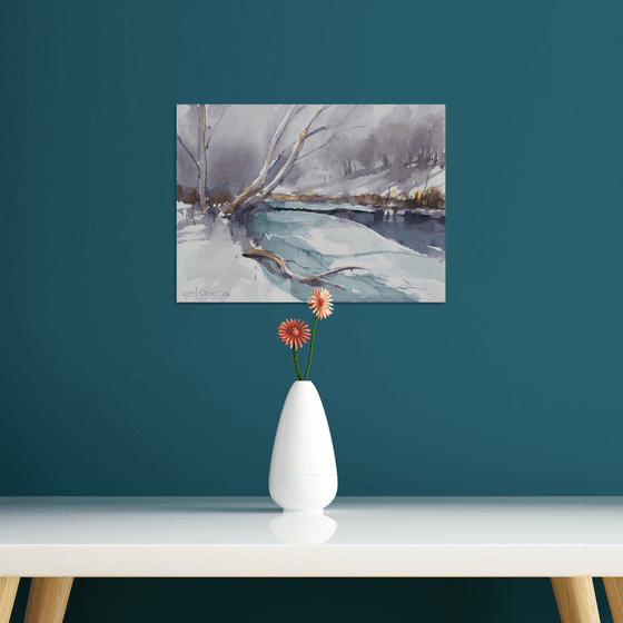 Snowscape with frozen river