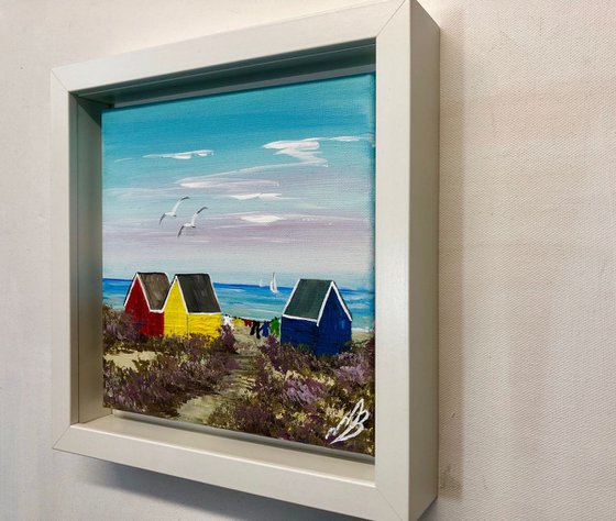 Three beach huts on the beach