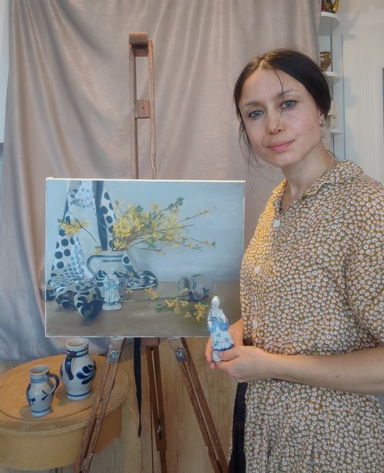 Yellow flowers and a statuette