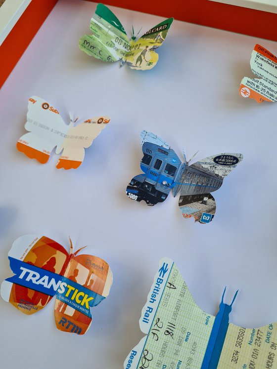 Free Spirit - Orange.  Butterflies hand cut train tickets from around the world.