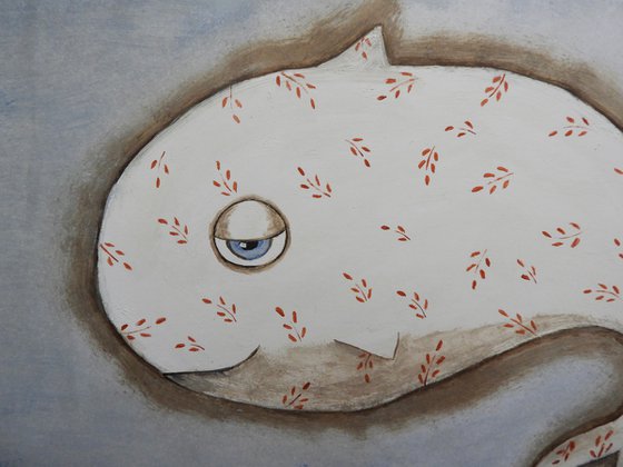 the white fish full of red leaves