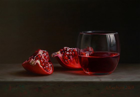 Pomegranate with a glass