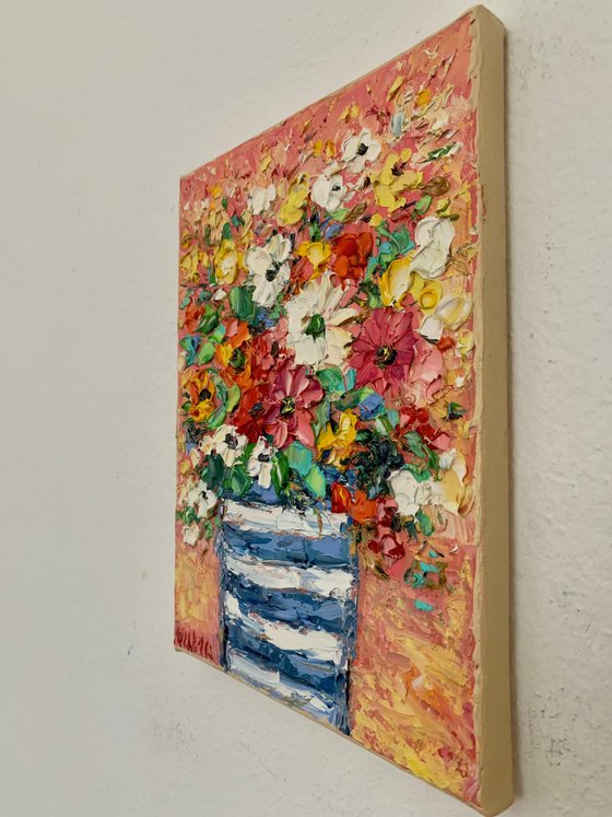 Flowers bouquet in striped vase