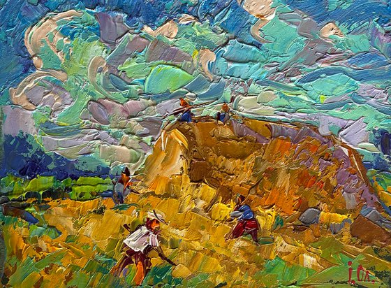 Working in the field with hay