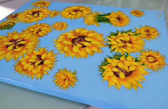 Sunflowers over the blue sky.