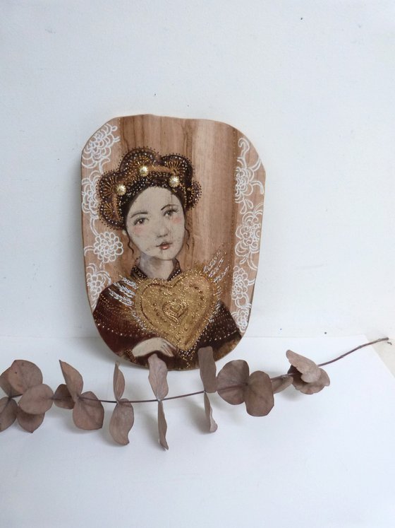 Portrait on wood, woman with a sacred heart. Sacred flight.