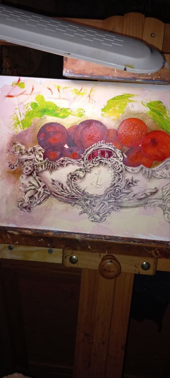 Plums in an antique fruit bowl