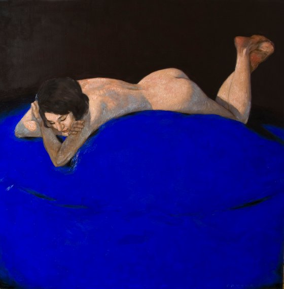 portrait of a nude woman on blue background