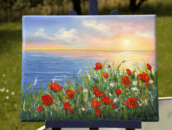 Sunset seascape and poppies