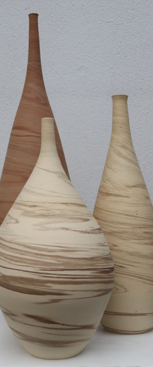 Three mixed clay vessels by Koen Lybaert