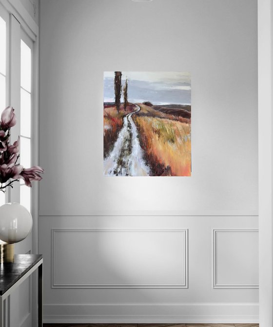 Landscape. Road through a field