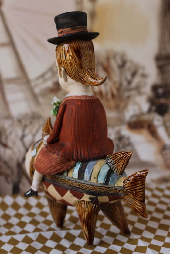 Vintage dressed boy riding the fish. From "Le Carousel, Hommage à l'Innocence" project by Elya Yalonetski