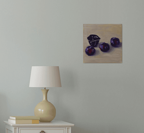 Three plums with japanese tea cup