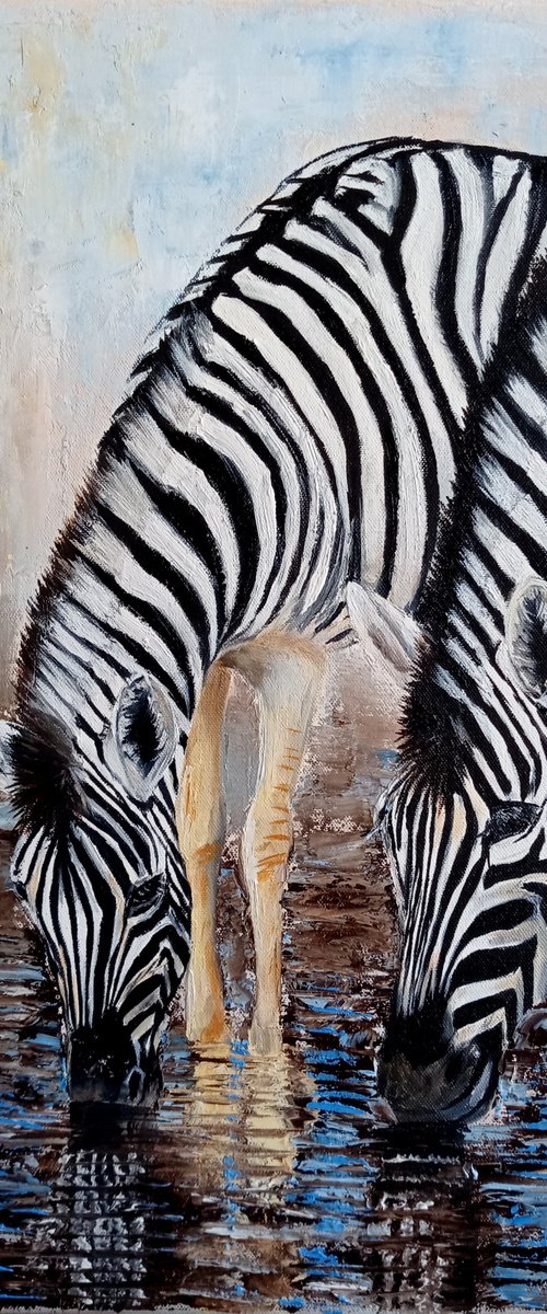 Zebras at the watering hole by Ira Whittaker