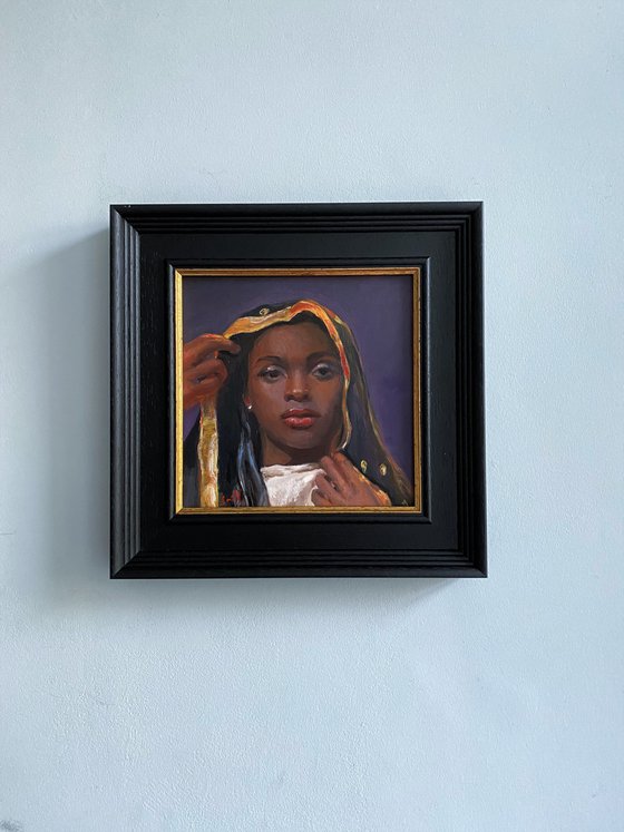 Young Black Woman oil portrait with frame.