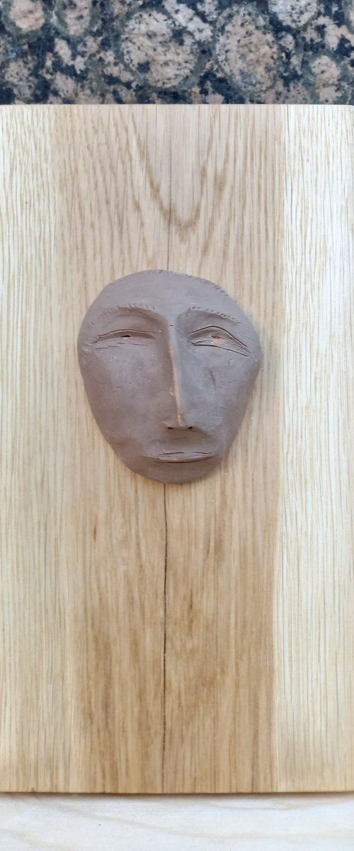 "Estimate" - clay wall sculpture by Rasho Mitev