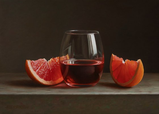 Grapefruit with a glass