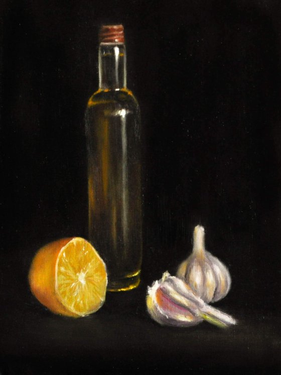 Still life with garlic, lemon and spicy oil