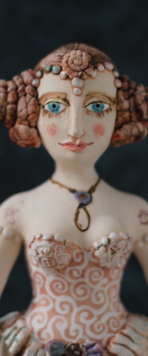 From the Naked clay series, Girl with chignon double bun. Wall sculpture by Elya Yalonetski by Elya Yalonetski