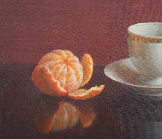 Cup of coffee and tangerine