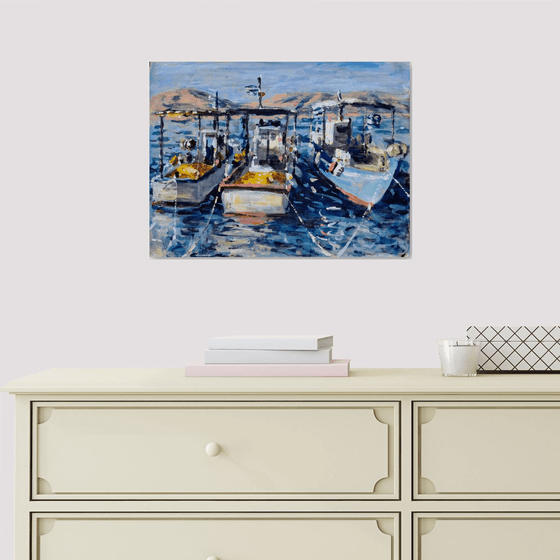 Three wooden boats