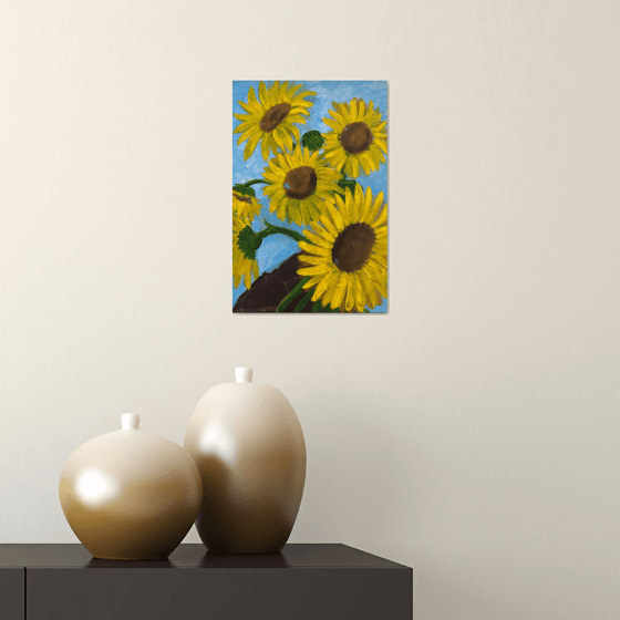 Sunflowers bouquet in hand