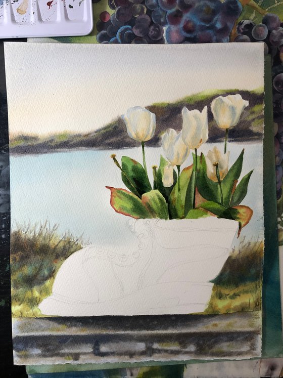 White tulips in old shoe planter sea view